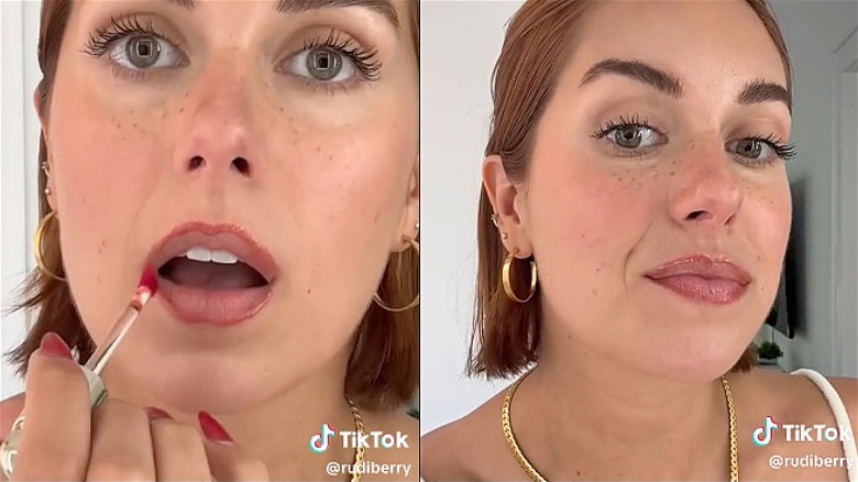 Woman applying lip stain as lip liner