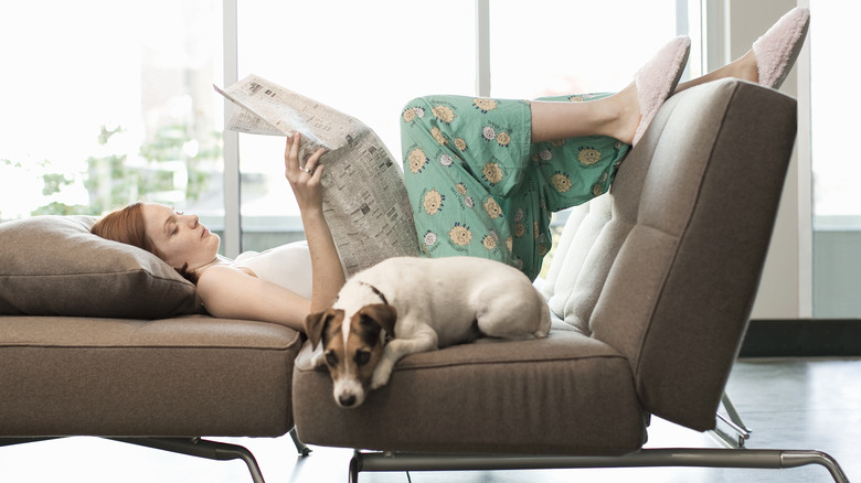 Woman on couch with dog