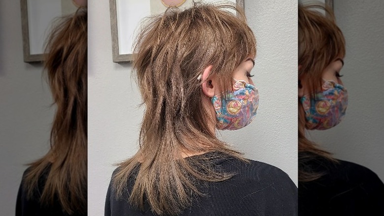 Shaggy haircut and printed mask