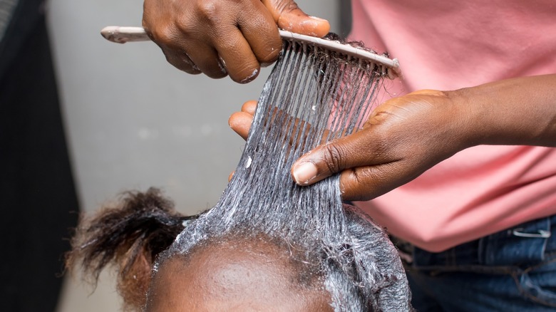 Person getting their hair dyed