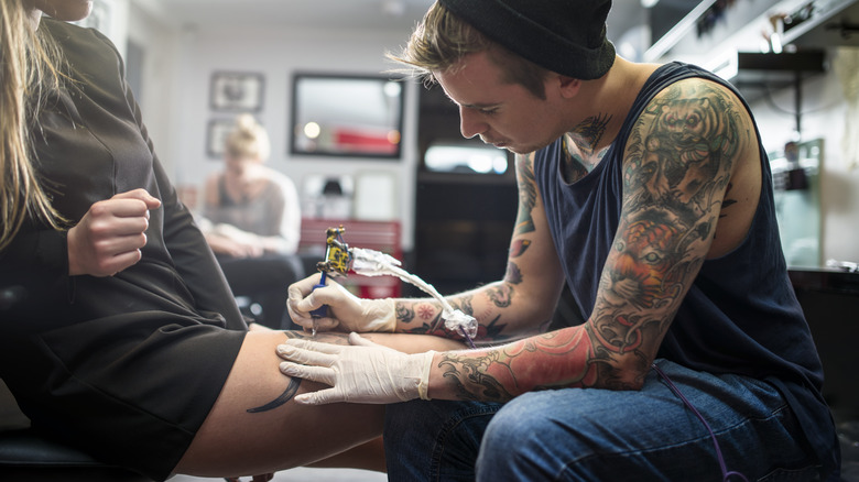 Getting leg tattoo
