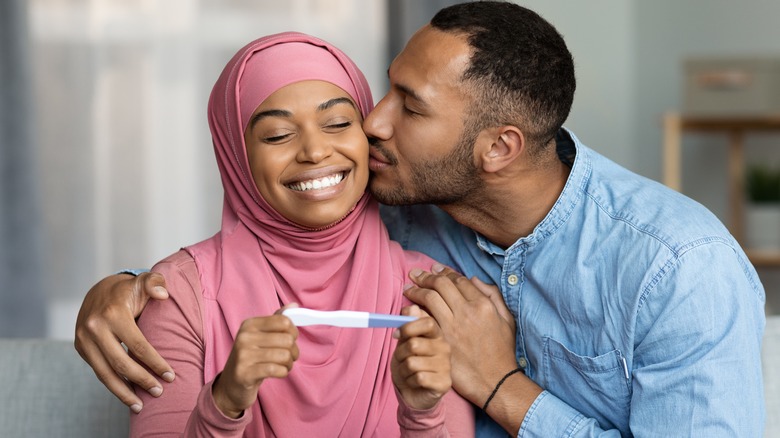 couple with pregnancy test