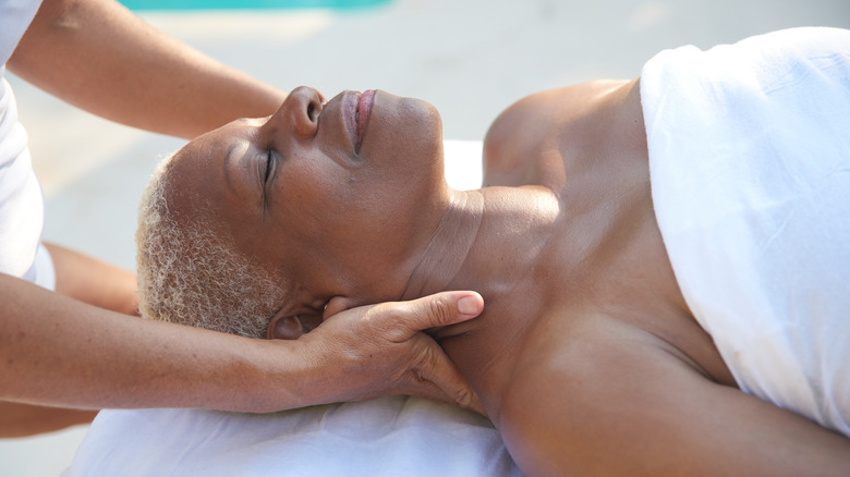 Woman receiving massage treatment