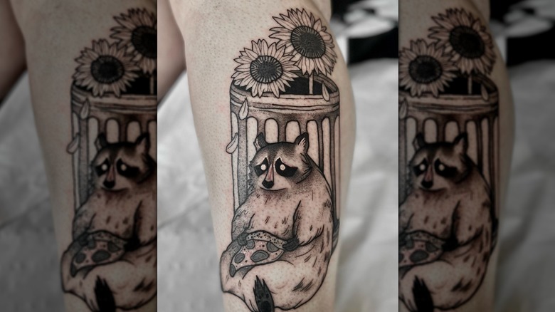 Raccoon with pizza tattoo
