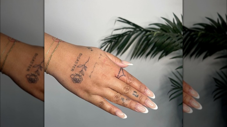 Delicate tattoos on hand