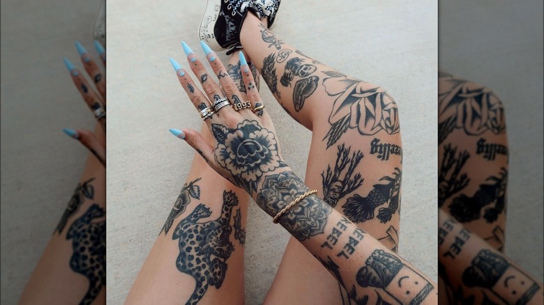 Patchwork tattoos on arms and legs