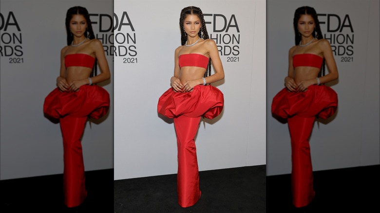 Zendaya in a red crop top and skirt